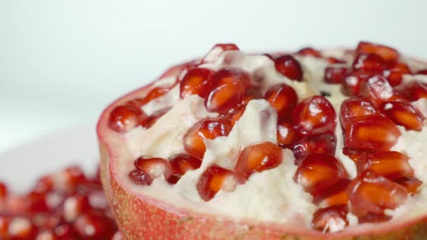 Pomegranate and grains on a rotating table — Stock Video