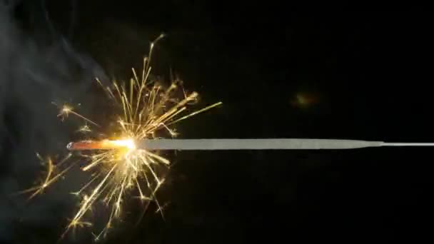 Bengal fire on the dark black background, Christmas sparkler — Stock Video