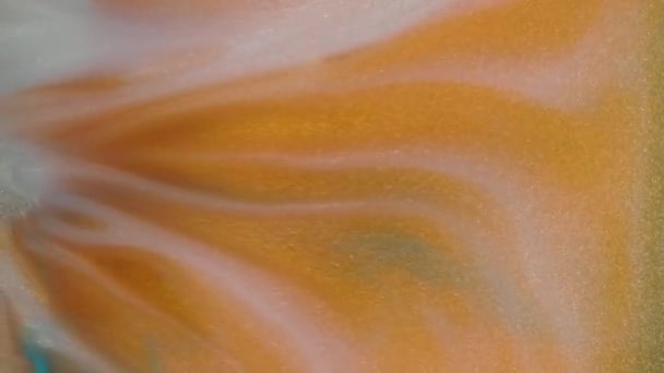 Colorful golden sand organically moves in colorful liquid — Stock Video