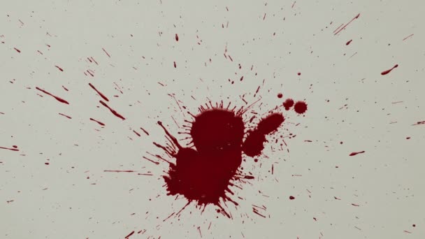 Il sangue rosso gocciola sulla carta bianca — Video Stock