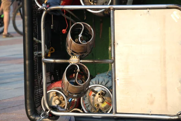 The basket with the Gas burners for the balloon lies on the ground. Preparation of balloon for flight. Festival of balloons