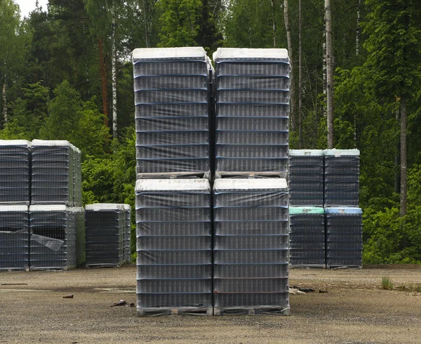 Finished products of clean bottles are packed in pallets. Racks