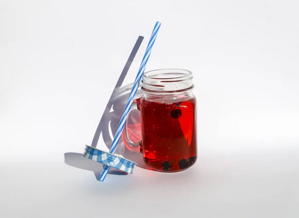 Summer berry lemonade in glass jar-mug with lid and  straw on  white background. — Stock Photo, Image