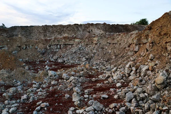 textures of various clay layers underground in  clay quarry after  geological study of the soil. colored layers of clay and stone in  section of the earth, different rock formations and soil layers.