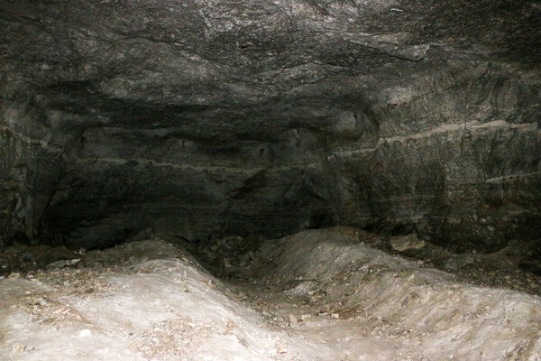 old abandoned galleries, adits, for extraction and processing of natural stone and gypsum cave. Dark eerie stone, quartz tunnels deep in earth. Various rocks, geological and speleological research.