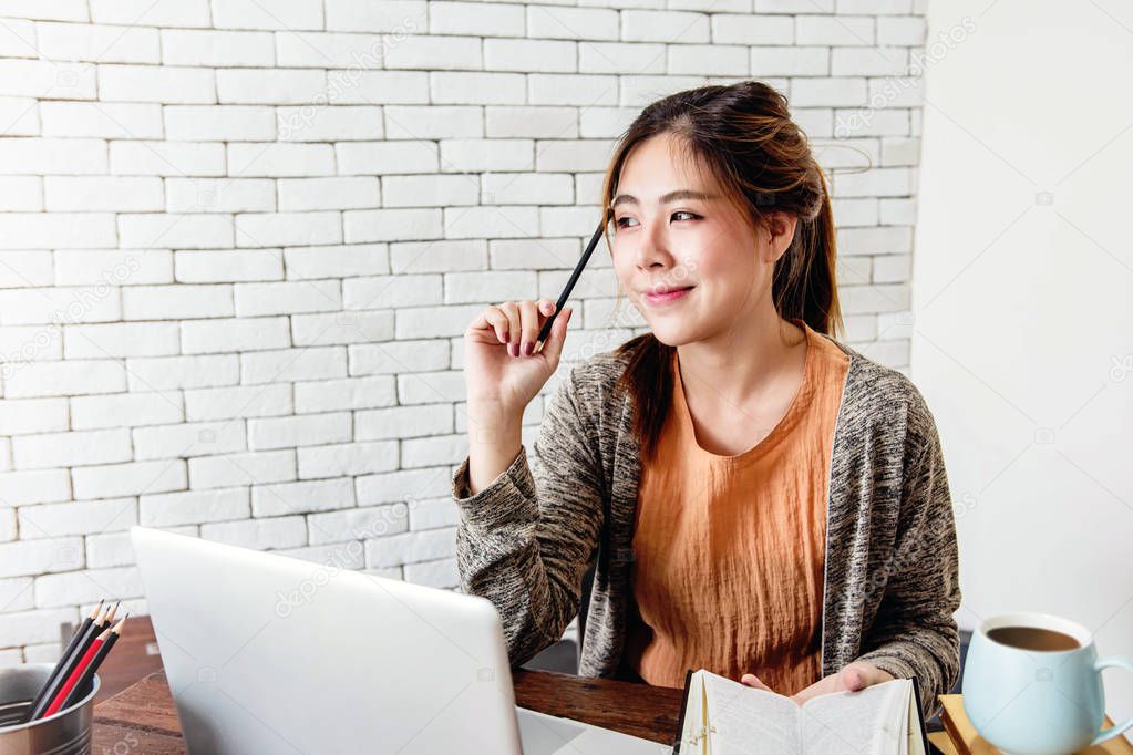 Young Freelancer Woman Thinking and Working on Computer Laptop in Cozy House, Modern Lifestyle of New Generation People