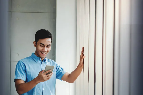 Happy Businessman Smartphone Standing Window Office — Stock Photo, Image