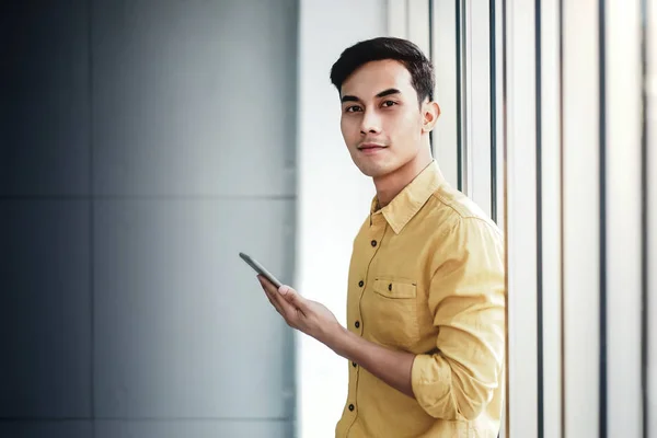 Portrait of Happy Businessman Standing by the Window in Office. — Stock Photo, Image