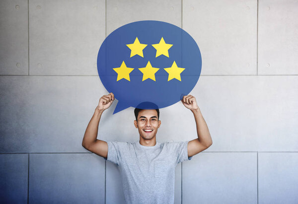 Customer Experience Concept. Young Man with Happy Face Showing F