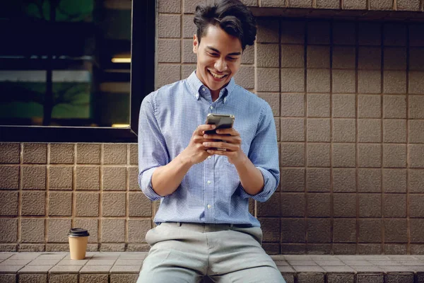 Smiling Young Asain Businessman Using Mobile Phone City — Stock Photo, Image