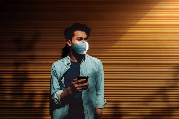 Young Asian Man Wearing Surgical Mask Using Smart Phone Standing — Stock Photo, Image