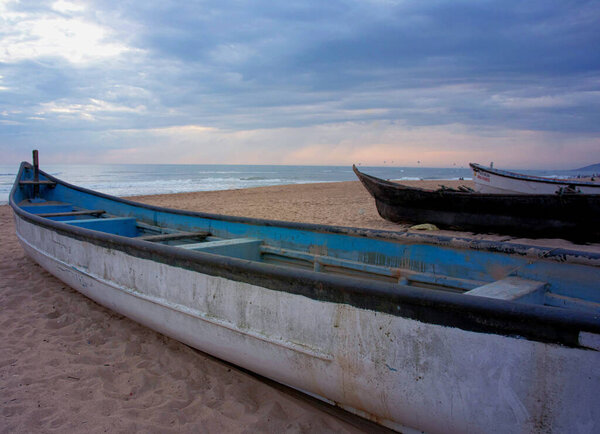 boats at the Baga beach with beautiful backdrop of sunset with vibrant colours