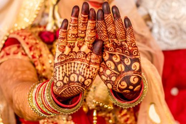 Indian Bride getting ready for the marriage with mehndi on her hand sambalpur,orrisa,india 02082019 clipart