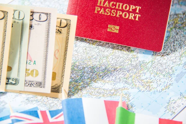 Going to travel. Passport, money, flags of Greece, UK, Italy, France on map. Save money on travel, planning for budget concept. Summer vacation