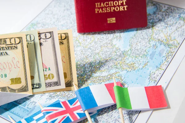 Going to travel. Passport, money, flags of Greece, UK, Italy, France on map. Save money on travel, planning for budget concept. — Stock Photo, Image