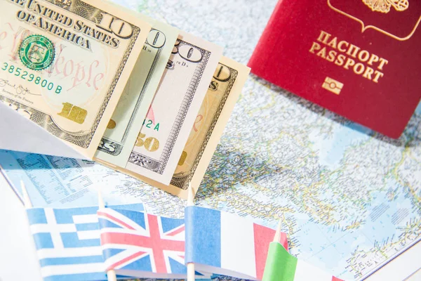 Going to travel. Passport, money, flags of Greece, UK, Italy, France on map. Save money on travel, planning for budget concept. Summer vacation