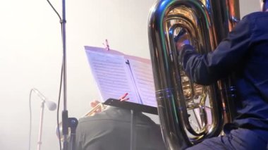 Tubaist in an orchestra on the stage