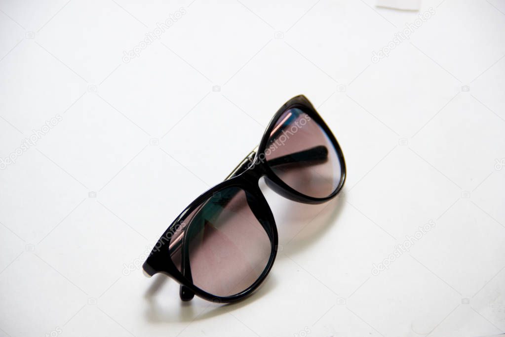 Black sunglasses on white back