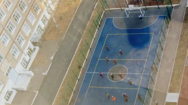 Aerial view of chidren playing football at — Stock Video