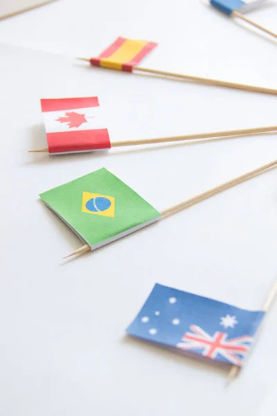 Braziliaans papier vlag onder andere landen vlaggen op witte achtergrond — Stockfoto
