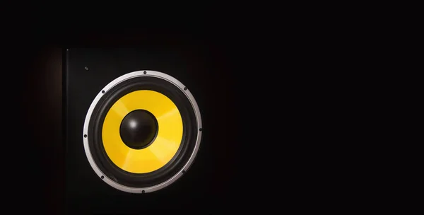 Yellow loudspeaker close on the dark background close up shot — Stock Photo, Image