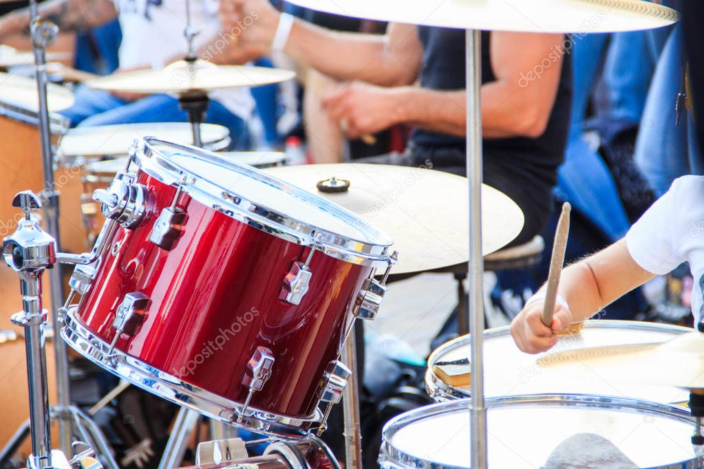 Street music band plays on various drum kits