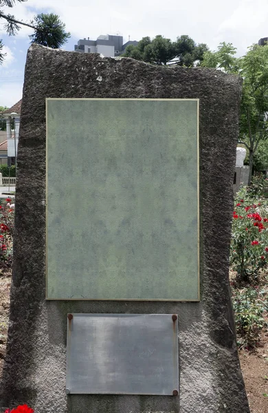 memorial plaque sign stone outdoors empty blank bronze
