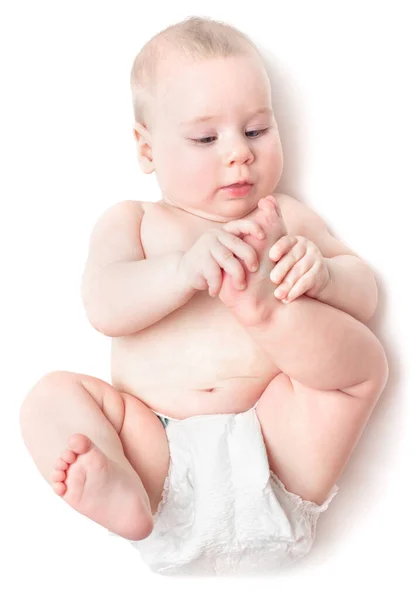 Small Beautiful Caucasian Child Lies Back Licks Foot Isolated White — Stock Photo, Image