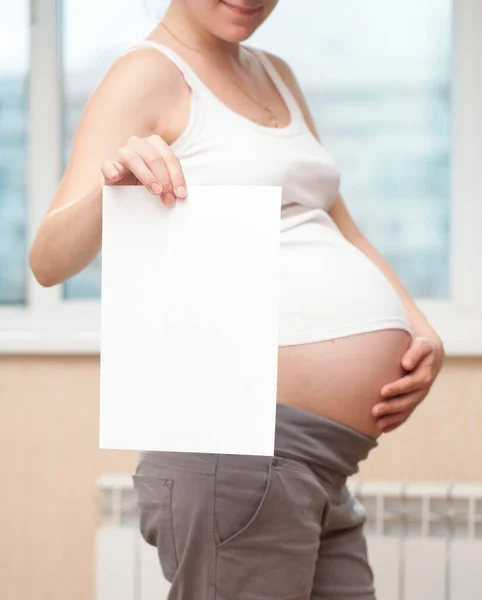 Την Έγκυο Γυναίκα Ένα Καθαρό Φύλλο Χαρτιού Για Κείμενο — Φωτογραφία Αρχείου