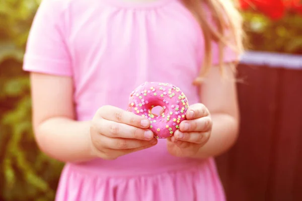 Little Girl Glasses Pink Dress Eating Sweet Donut — Stock Photo, Image