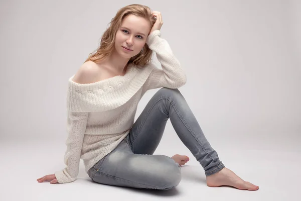 Beautiful Young Girl Posing Sitting White Background Blonde White Sweater — Stock Photo, Image