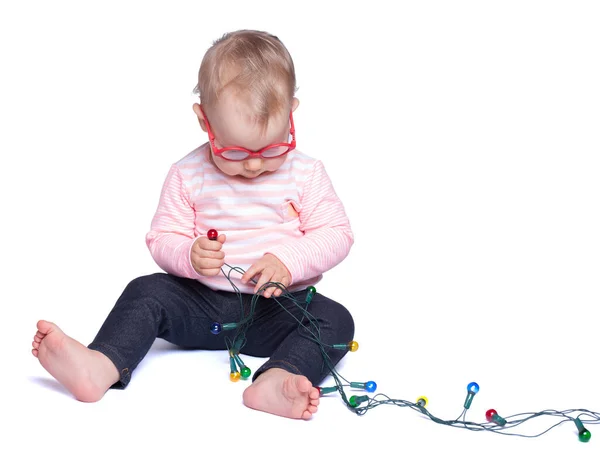 Little Girl Sitting White Background Playing Christmas Lights Isolated White — Stock Photo, Image