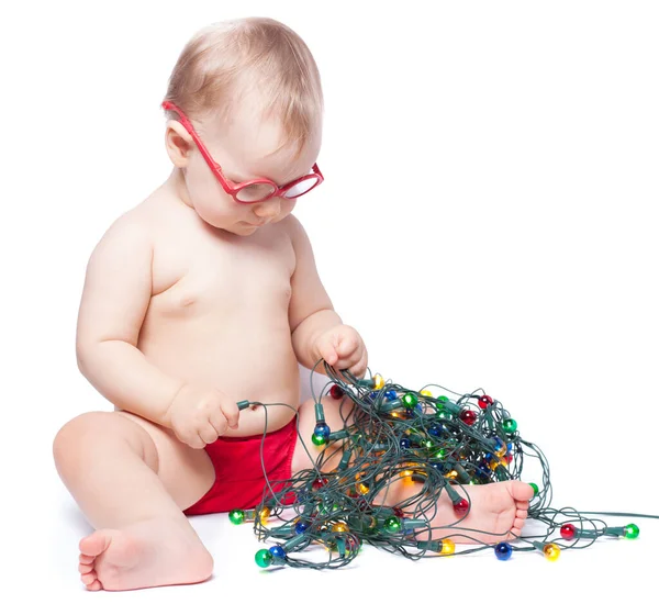 Little Girl Sitting White Background Playing Christmas Lights Isolated — Stock Photo, Image