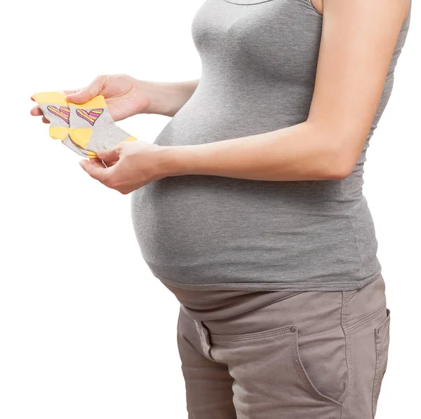 Kobieta Ciąży Trzyma Skarpetki Dla Dzieci Dłoni — Zdjęcie stockowe