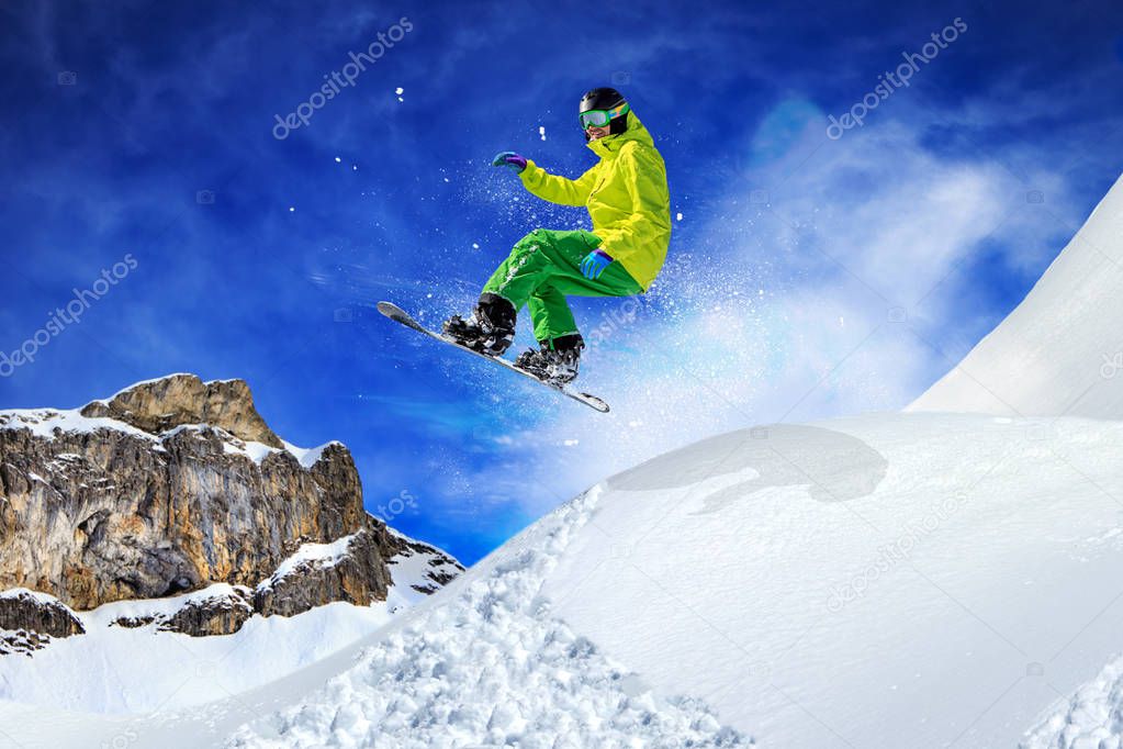 A snowboarder on the piste in Alps in Austria