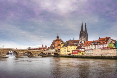 The Cityscape of Regensburg town with the Eisernen Bruecke, Germany. clipart