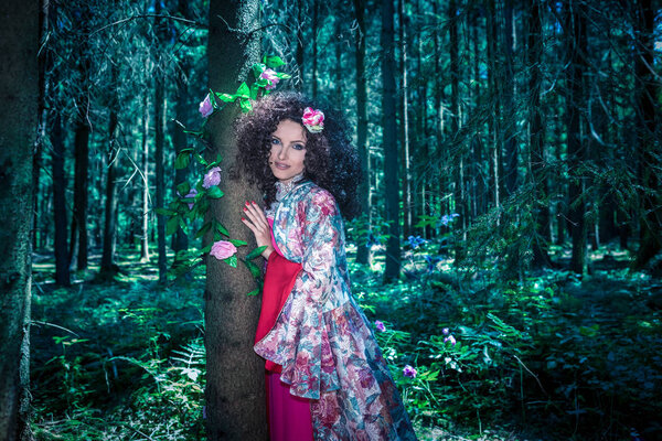 An outdoor portrait of a young wonan in the fairytale style