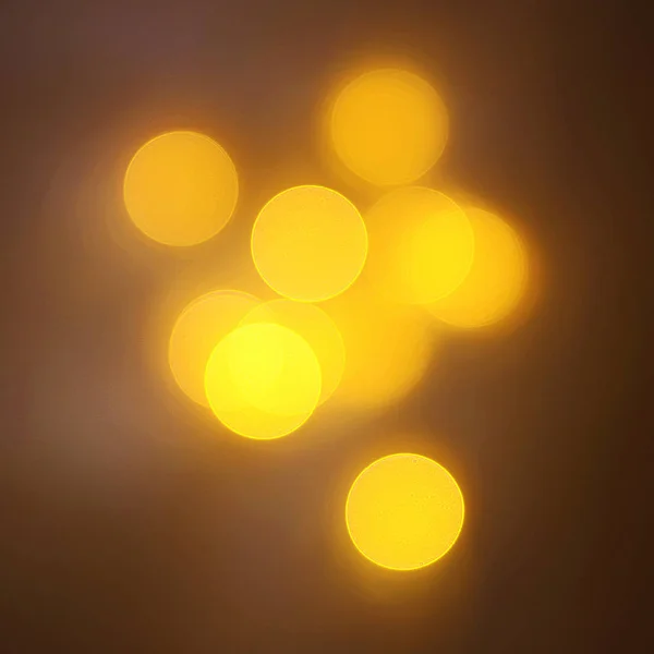 geometrik öğeleri üzerinde karanlık bir arka plan deseni ile güzel altın bokeh
