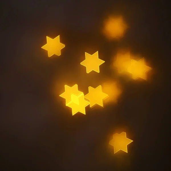 geometrik öğeleri üzerinde karanlık bir arka plan deseni ile güzel altın bokeh