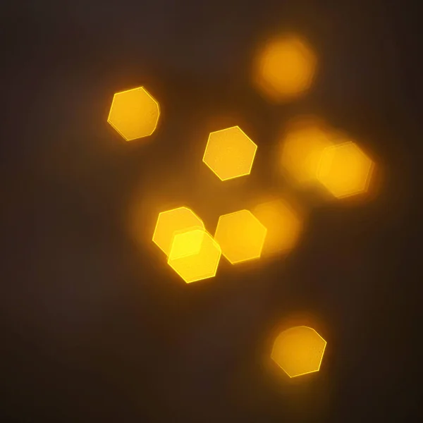geometrik öğeleri üzerinde karanlık bir arka plan deseni ile güzel altın bokeh