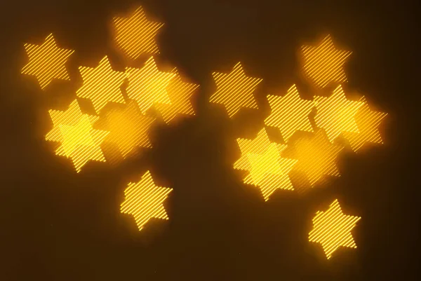 geometrik öğeleri üzerinde karanlık bir arka plan deseni ile güzel altın bokeh