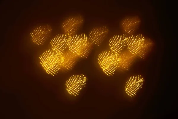 geometrik öğeleri üzerinde karanlık bir arka plan deseni ile güzel altın bokeh