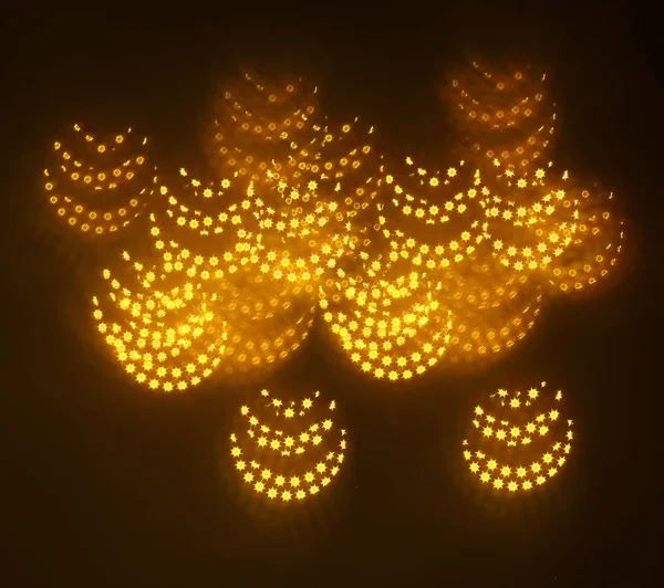 geometrik öğeleri üzerinde karanlık bir arka plan deseni ile güzel altın bokeh