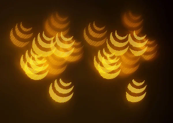 geometrik öğeleri üzerinde karanlık bir arka plan deseni ile güzel altın bokeh