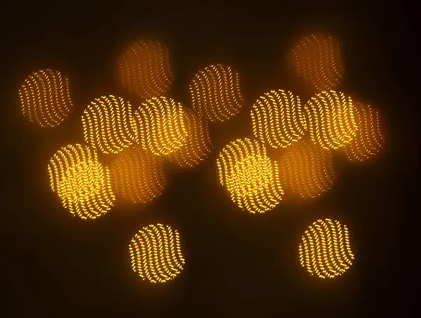 geometrik öğeleri üzerinde karanlık bir arka plan deseni ile güzel altın bokeh