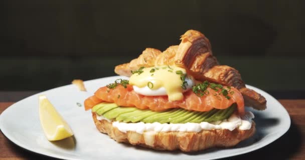 Closeup Delicious Croissant Soft Cheese Avocado Salmon Fillet Egg Benedict — Stock Video