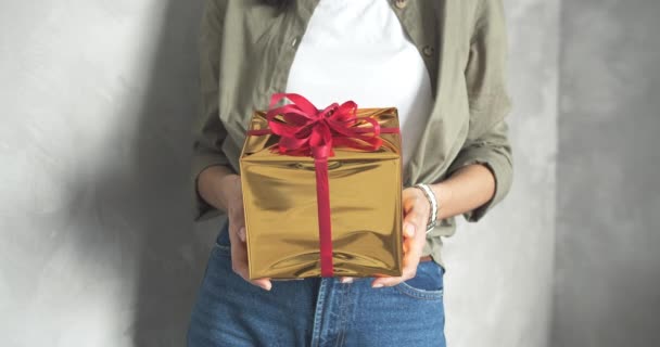 Close Female Hands Holding Bright Gift Box Red Ribbon Gray — Stock Video