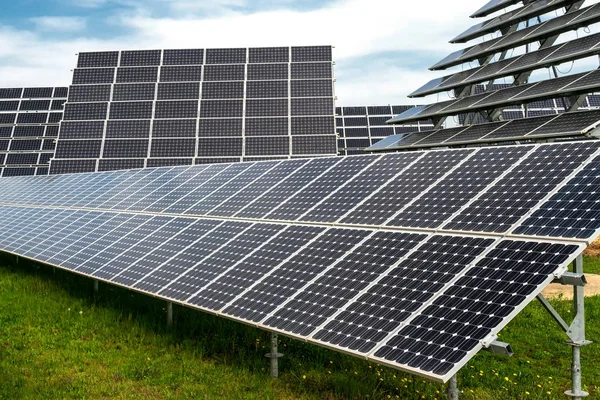 Solar panels, photovoltaics, with sun tracking systems -  alternative electricity source, concept of sustainable resources