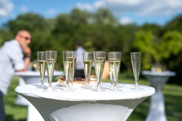 Welcome drink, view of glasses filled with champagne on a table