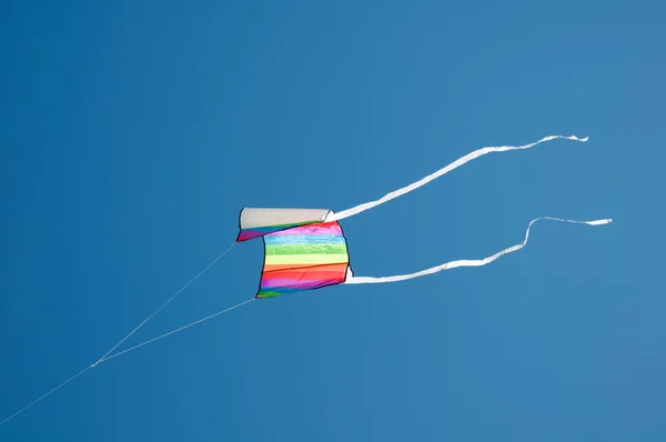 Colorful kites flying in blue sky — Stock Photo, Image